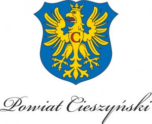 grafika-herb powiatu cieszyńskiego, żółty orzeł na niebieskim tle, pod nim napis Powiat cieszyński